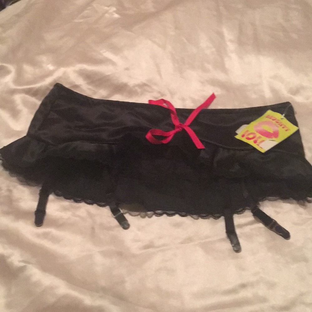 NWT. Satin garter skirt, black with red accents.